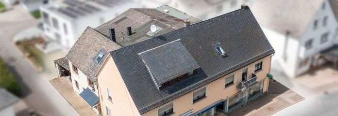 Profit-generating residential and commercial building in an up-and-coming municipality (13 times annual rent)