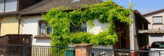 Rare edge-of-field location: small house with potential for your living ideas