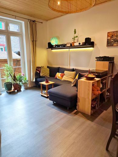 Wohnen in Bestlage: Stilvolle Doppelhaushälfte in der BASF-Kolonie – Wohnungszimmer EG