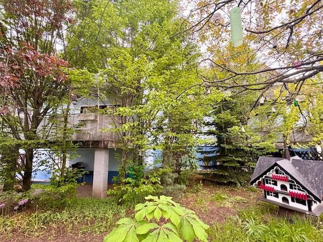 Bright 3-room ground-floor apartment with balcony and large private-use garden – Garten