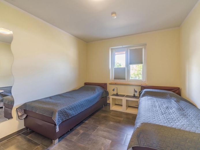 Traumhaftes Holzhaus mit Sauna, großer Terrasse auf 931 m² Eckgrundstück nahe St. Peter-Ording – Schlafzimmer