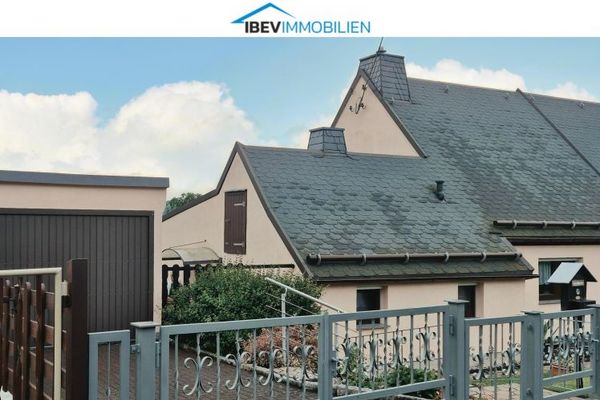 Casa bifamiliare ben tenuta con un bel terreno giardino