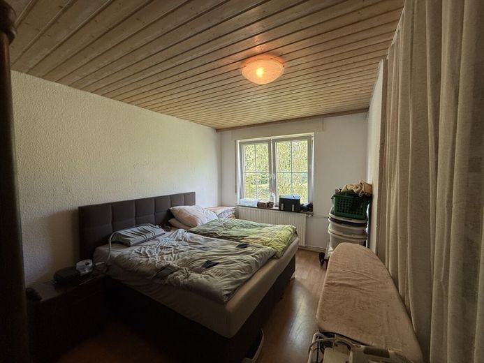 Charmante Doppelhaushälfte mit großzügigem Grundstück in ruhiger Wohnlage von Verl – Schlafzimmer