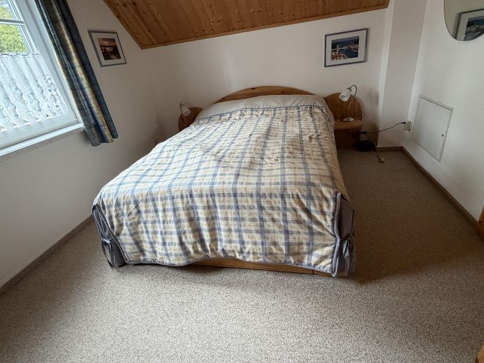Casa de vacaciones con embarcadero propio en Hafendorf Rheinsberg – Gästezimmer Schlafen