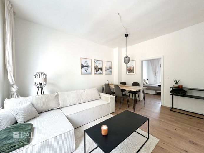 Mehrfamilienhaus-12 Wohnungen-Energieklasse A – Wohnzimmer