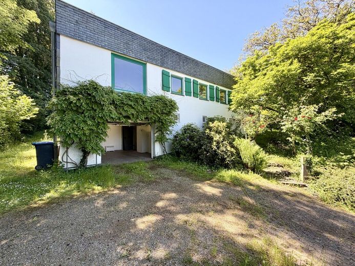 Absolute Rarität: Bungalow in Schildgen mit 6.612 m² Grundstück in direkter Waldrandlage – Hausansicht