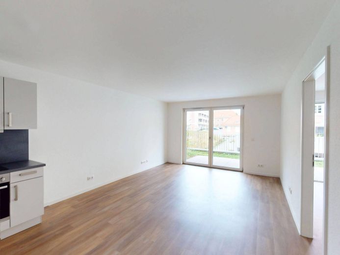 2-kamer-nieuwbouwwoning met TERRAS en ingerichte keuken op loopafstand van het Kurpark – Ansicht I: Wohn- und Esszimme…