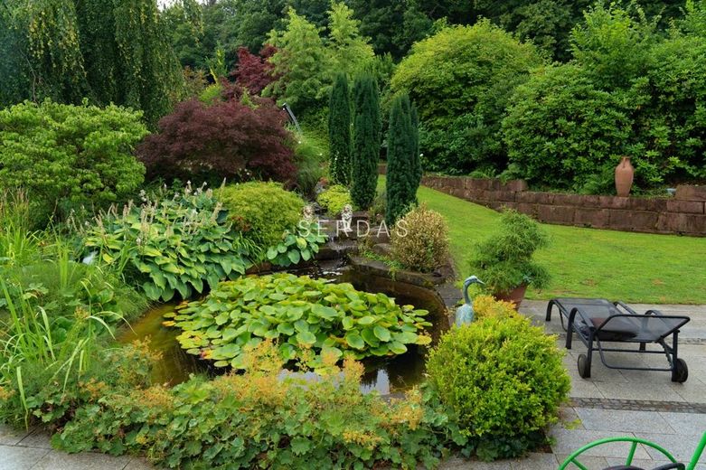 Architektenvilla in ruhiger Höhenlage mit Panoramablick und großem Grundstück – Garten