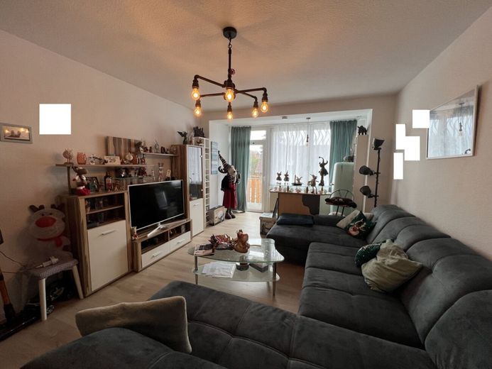 Wohnen mit Charakter - großzügige Altbauwohnung mit Balkon und Carport in Minden - Süd – Gemütliches Wohnzimmer