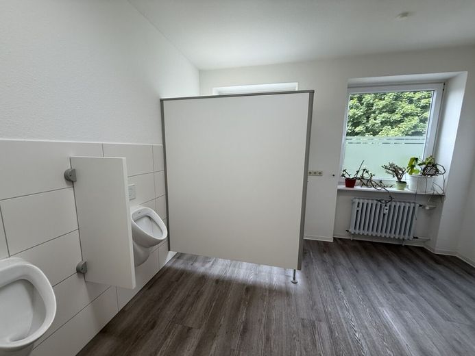 Attraktive Kapitalanlage mit ca. 6,45 % Rendite - Postverteilzentrum mit Wohn- und Gewerbeeinheiten in Herford – Toiletten EG