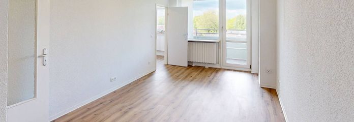 Einziehen. Einkuscheln. 1. Kaltmiete sparen: Helles 1-Zimmer-Appartement mit Balkon – Ansicht I: Wohnzimmer