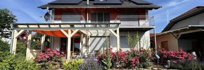 Außergewöhnliches Architektenhaus mit Gallerie & nachhaltiger Energietechnik in sonniger Lage – Gartenseite