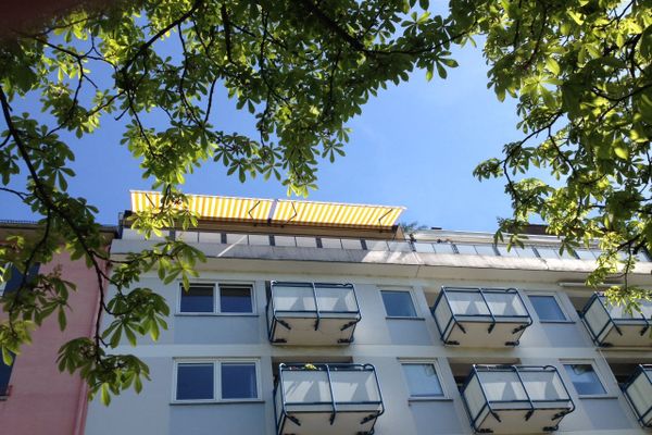 centrally located and fully renovated, partially furnished penthouse gem right by Wilhelmsplatz with elevator