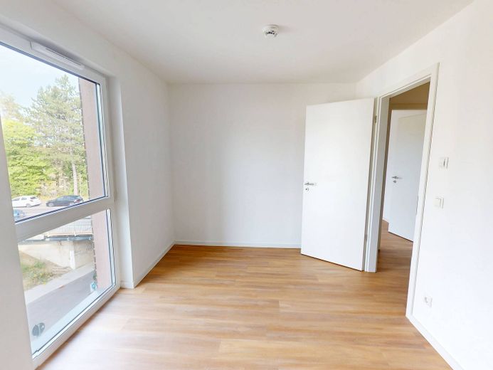 Oasi di benessere inondata di luce di 83 m²: moderno appartamento di 3 locali con balcone a Villingen – Ansicht I: Schlafzimmer I