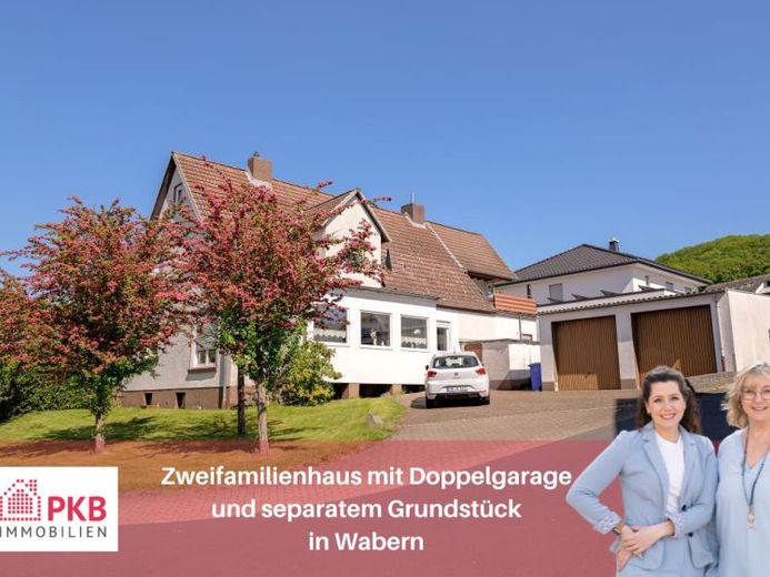 Wohnen im Grünen: Attraktives Zweifamilienhaus mit viel Platz und Doppelgarage – Foto 1