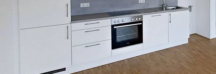 Modernes 1-Zimmer-Apartment mit EBK im Neubauquartier "Großherzog Friedrich Höfe" – Einbauküche mit Waschmaschine…