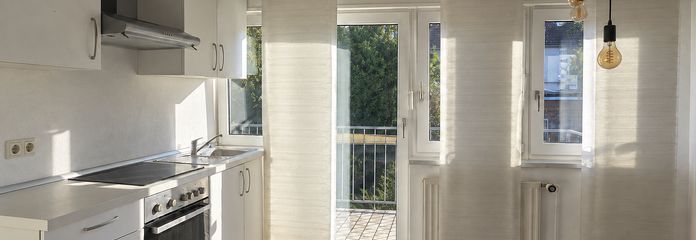 Cozy 2-room attic apartment with balcony and fitted kitchen in a quiet location