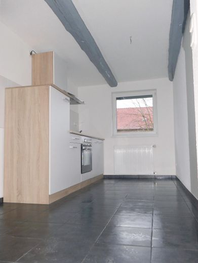 Hofstelle mit 7 Mietwohnungen, Lagerhalle, Garagen, Abstellräumen – Bsp Wohnung mit Kueche im OG