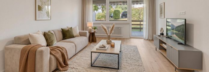 Jetzt die Ferienzeit nutzen! 3,5 Zi mit eigener Terrasse und extra Hobbyraum – Beispiel Wohnzimmer