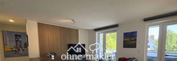 Penthouse au dernier étage en retrait avec vaste espace de vie, balcon et prestations haut de gamme
