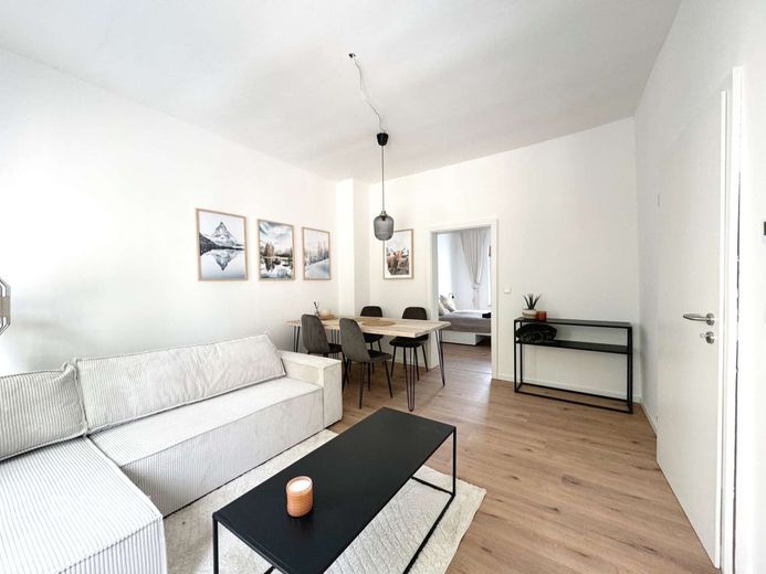 Mehrfamilienhaus-12 Wohnungen-Energieklasse A – Wohnzimmer