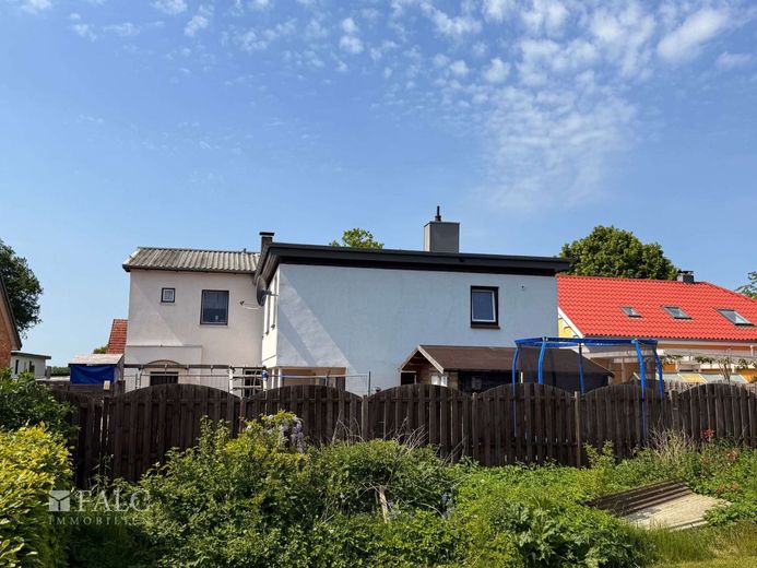 Zwei Einheiten. Voll vermietet. Solide Kapitalanlage in Sörup. – Außenansicht - Rückseite Bild 9