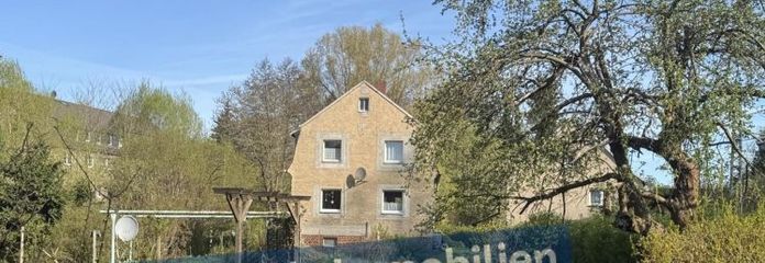 Einfamilienhaus mit großem Grundstück und Doppelgarage in ruhiger Lage!