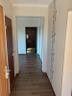Flooded with light 4-room apartment with large southwest loggia, garage and excellent connection to Hamburg – Flur1