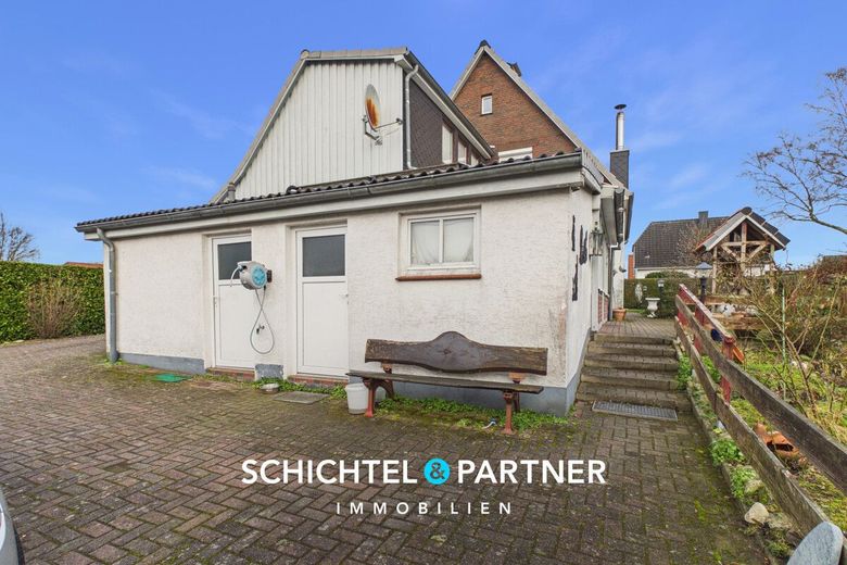 Hambergen | Freistehendes Einfamilienhaus mit Kamin und großem Grundstück – S&amp;P | Rückansicht