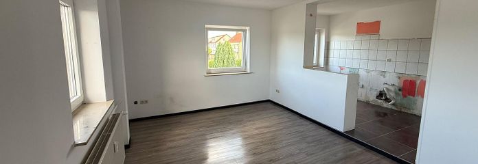 Wohnzimmer mit Küche