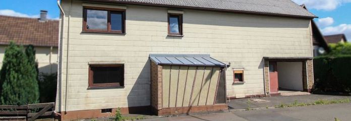 Einfamilienhaus mit Garten, Garage und Ausbaupotenzial in naturnaher Lage von Ulrichstein