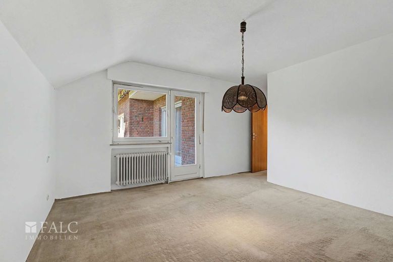 Wohnen mit Perspektive: Einfamilienhaus inklusive Einliegerwohnung auf 878 m² Sonnengrundstück – Schlafzimmer_EG