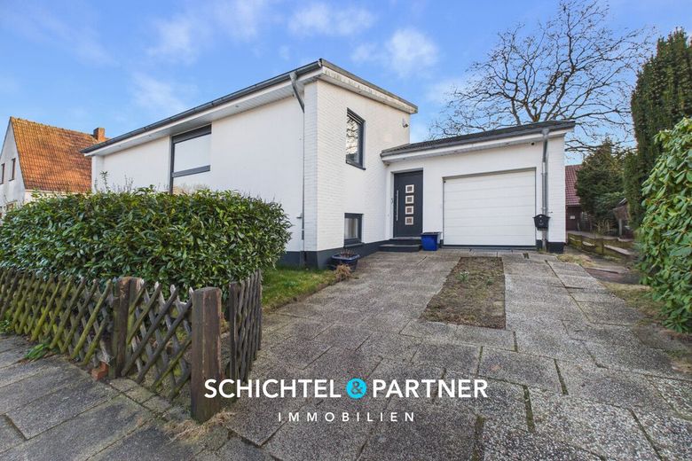 Osterholz | Hochwertig saniertes Einfamilienhaus mit großem Garten – S&amp;P | Frontansicht