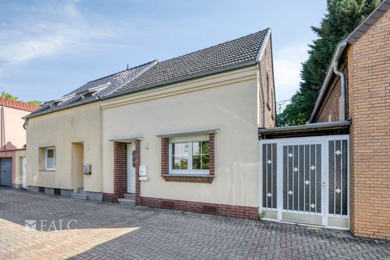Charmantes sanierungsbedürftiges Einfamilienhaus mit Potenzial in ruhiger Lage von Worringen – Titelbild