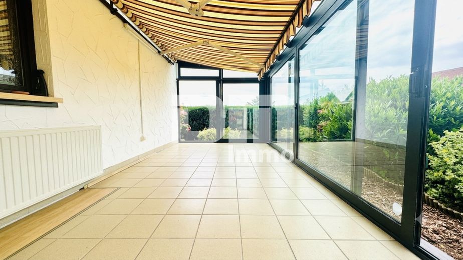Solider Familien-Bungalow mit großem Potenzial in ruhiger Lage mit Wintergarten und Garage – EG Wintergarten / Zugang Gartenbereich
