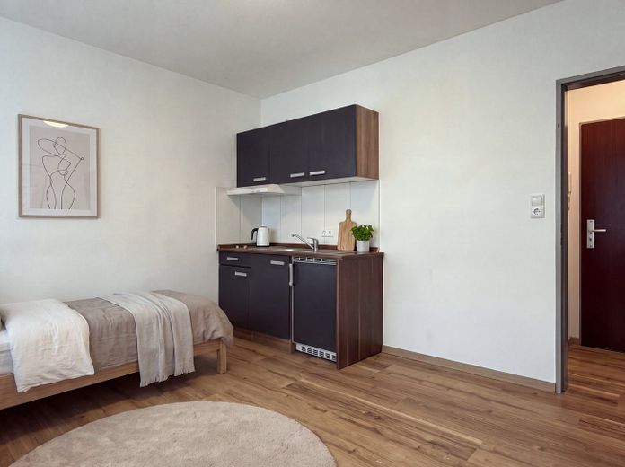 1-room apartment for rent in Vechta (WE 2.7) – Wohnraum/Küche (KI-Möblierung)