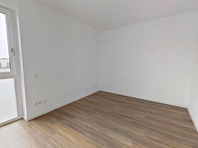 1. AFFITTO GRATUITO: Luminoso appartamento di nuova costruzione con 3 locali, balcone e cucina componibile – Ansicht I: Schlafzimmer I