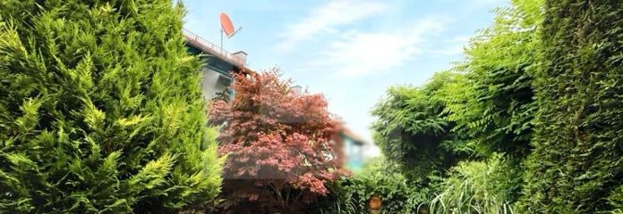 Casa adosada esquinera bien cuidada con jardín Feng Shui en una ubicación privilegiada en Oberbeuren