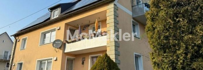 Immeuble collectif de 3 logements, isolation des murs extérieurs, installation photovoltaïque et potentiel du terrain en centre-ville de Burgheim
