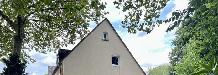 Половина будинку гірничого селища, Ессен-Край – Seitenansicht vom Garten