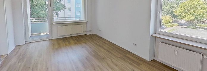 Moderne 3-Zi.-Whg. mit BALKON und EBK in fußläufiger Nähe zum Eiderufer – Ansicht I: Wohn- und Esszimmer