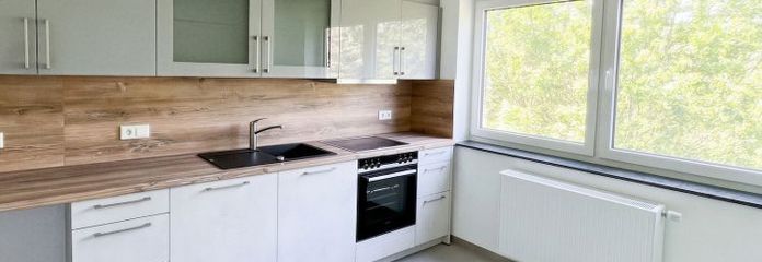 Stylish living in a green setting – 2-room apartment with high-quality fittings