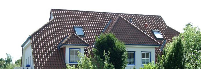 Haus mit Wohnung links unten
