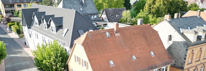 Ehemaliges Rat-/Schulhaus, denkmalgeschützes Mehrfamilienhaus in Friedrichsdorf – Hugenottenstr. 94 / Taunusstr.