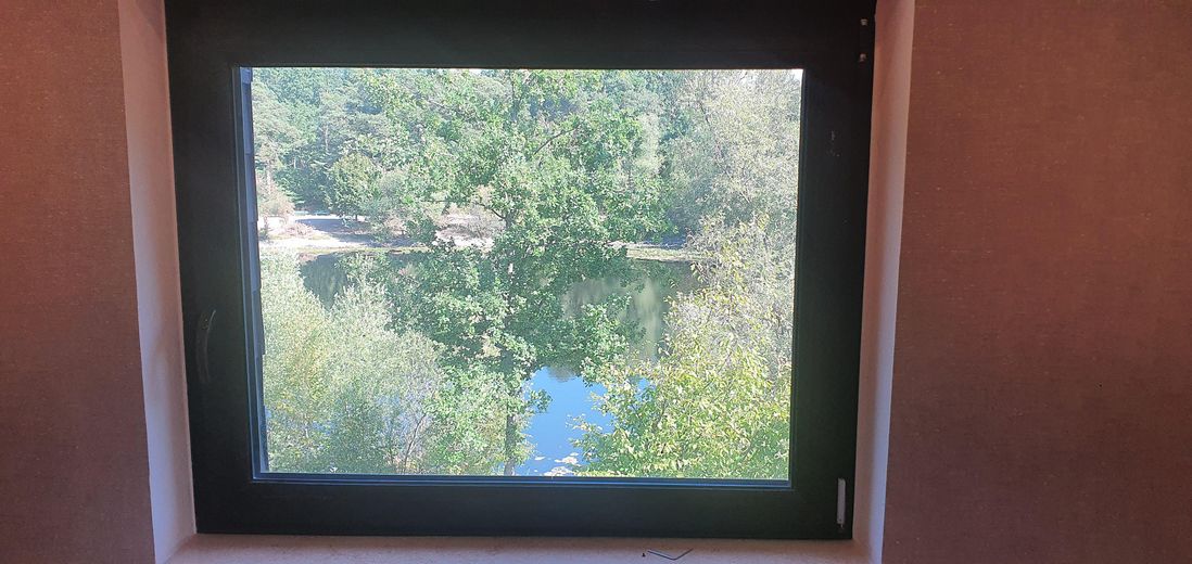 Traumvilla am See mit Einliegerwohnung – Blick auf den See vom Haus