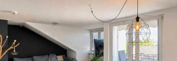 Investissement immobilier au-dessus des toits de Lüneburg – appartement mansardé loué avec balcon