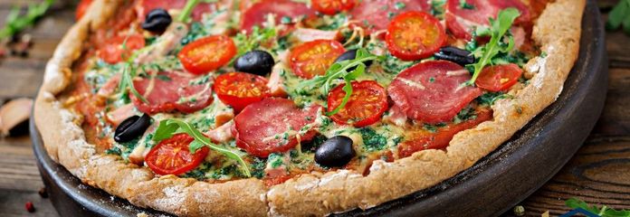 pizza-with-salami-tomatoes-olives-and-cheese-on-a-dough-with-whole-wheat-flour-italian-food