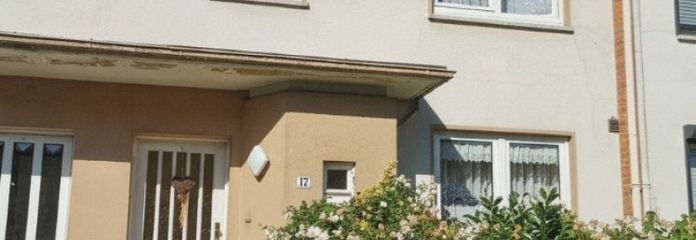 Spacious terraced house, full basement, converted attic, balcony, large garden in a quiet location & garage