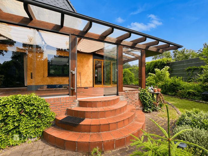 Gartenidylle mit Wintergarten-charmantes Einfamilienhaus zum Wohlfühlen in der Nähe von Langen – Eingang Wintergarten zum Grundstück