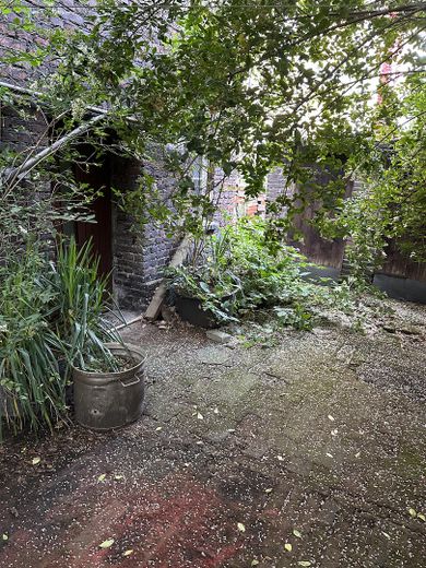 "Tradition trifft Innovation" - Vielseitig nutzbares Haus im idyllischen Backyard in Dortmund – Zugang vom Vorderhaus